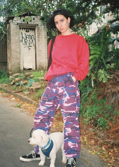 E^ST with her dog as seen in March 2020